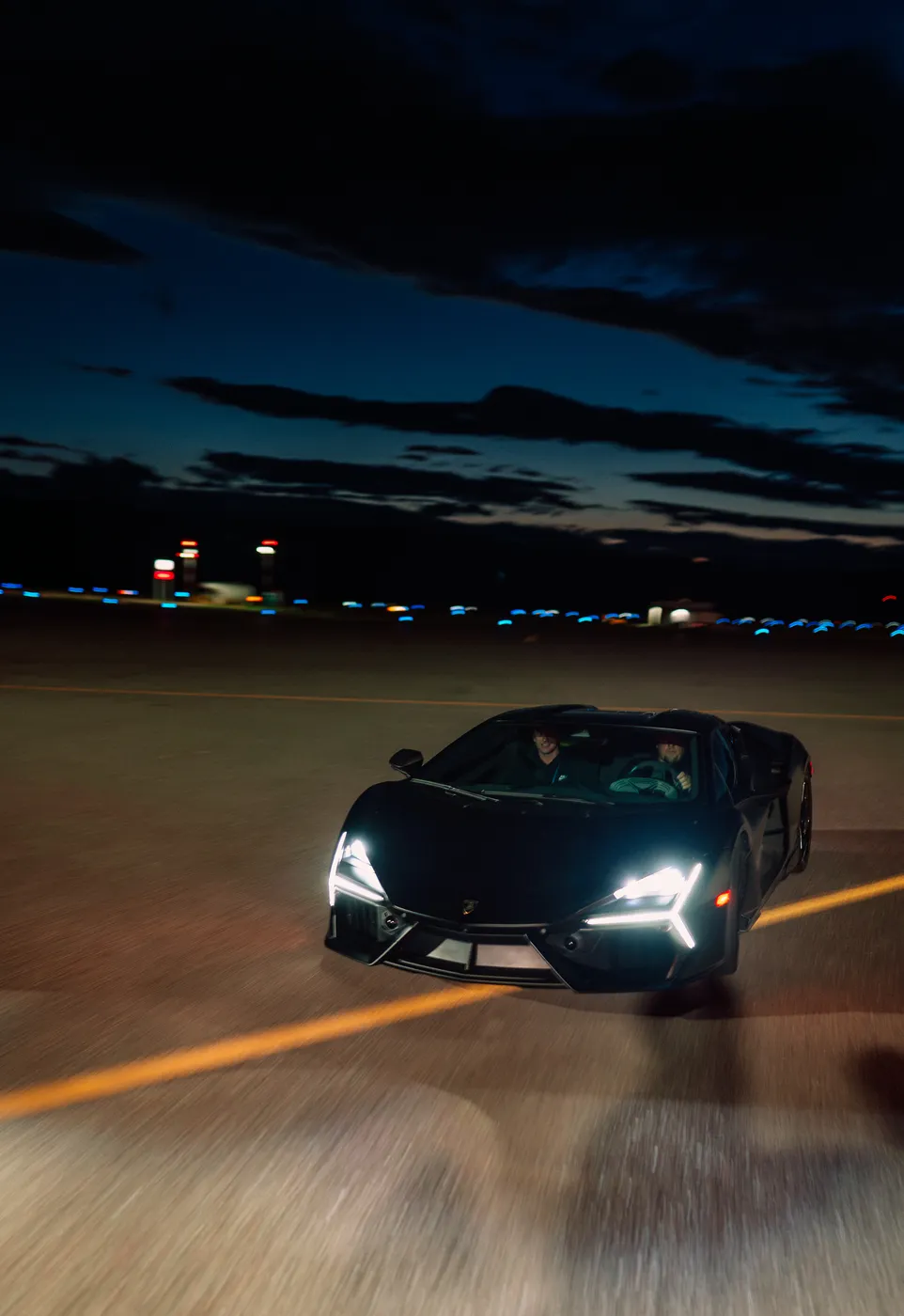 Revuelto rolling at night with headlights on